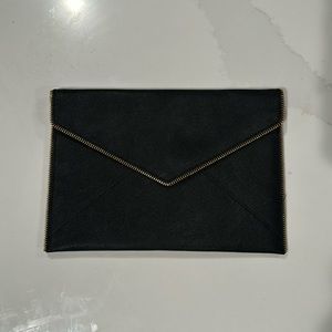 Black envelope clutch with gold detailing
